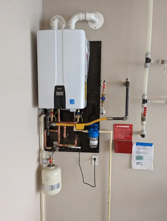 Professional plumber installing copper piping in a Paintsville home